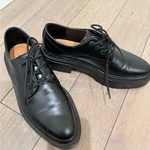 Black lace up shoes.
